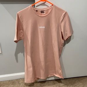 A M salmon colored GymShark t-shirt